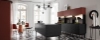 Cuisine moderne avec sol en carreaux géométriques et îlot noir de Nolte Kitchen.