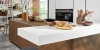 A modern kitchen with rustic elements and open shelving by Nolte Kitchen.