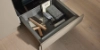 An open kitchen drawer with utensils from Nolte Kitchen.