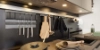 A modern kitchen with cooking utensils and sink, designed by Nolte Kitchen.