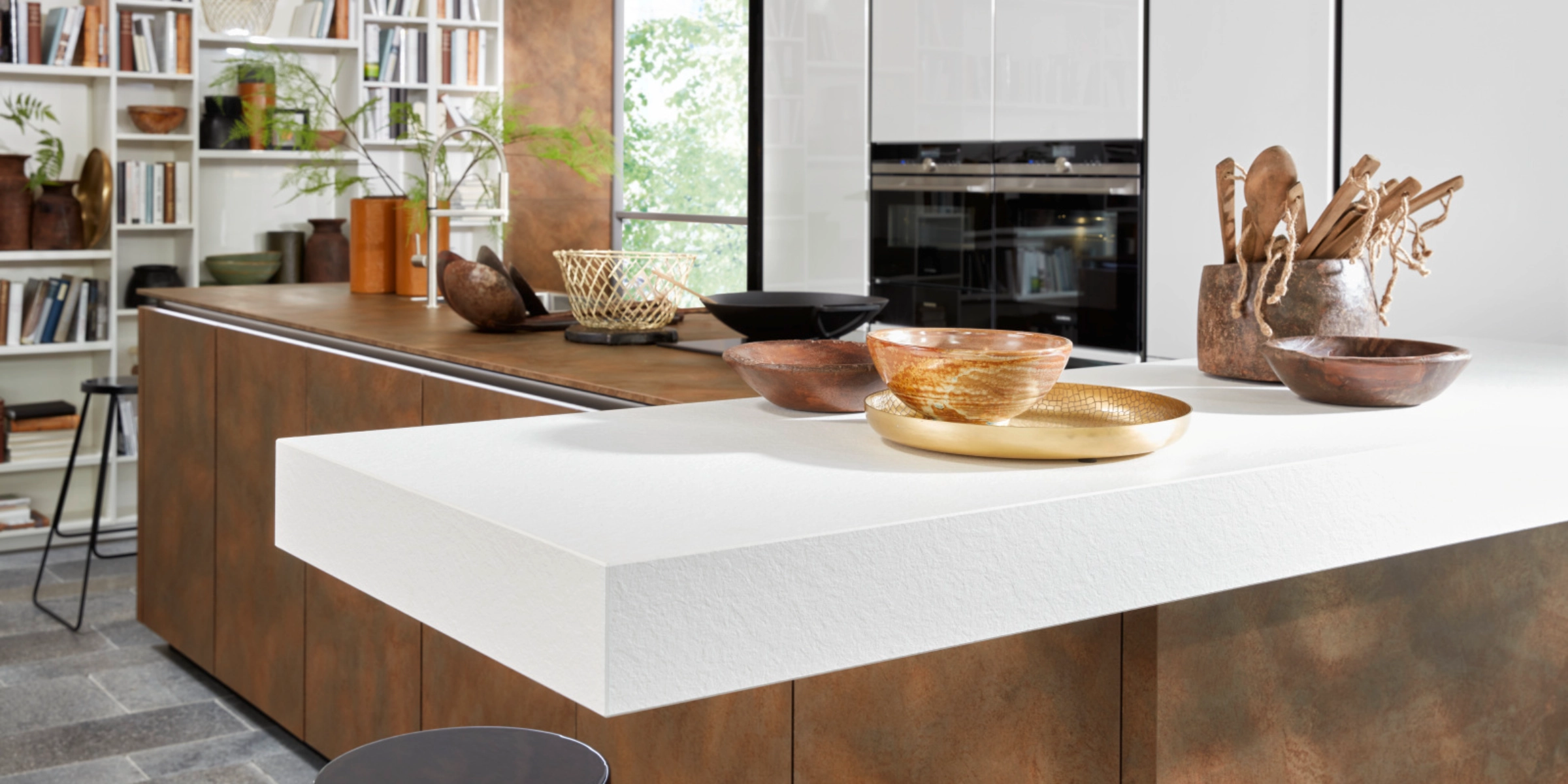A modern kitchen with rustic elements and open shelving by Nolte Kitchen.