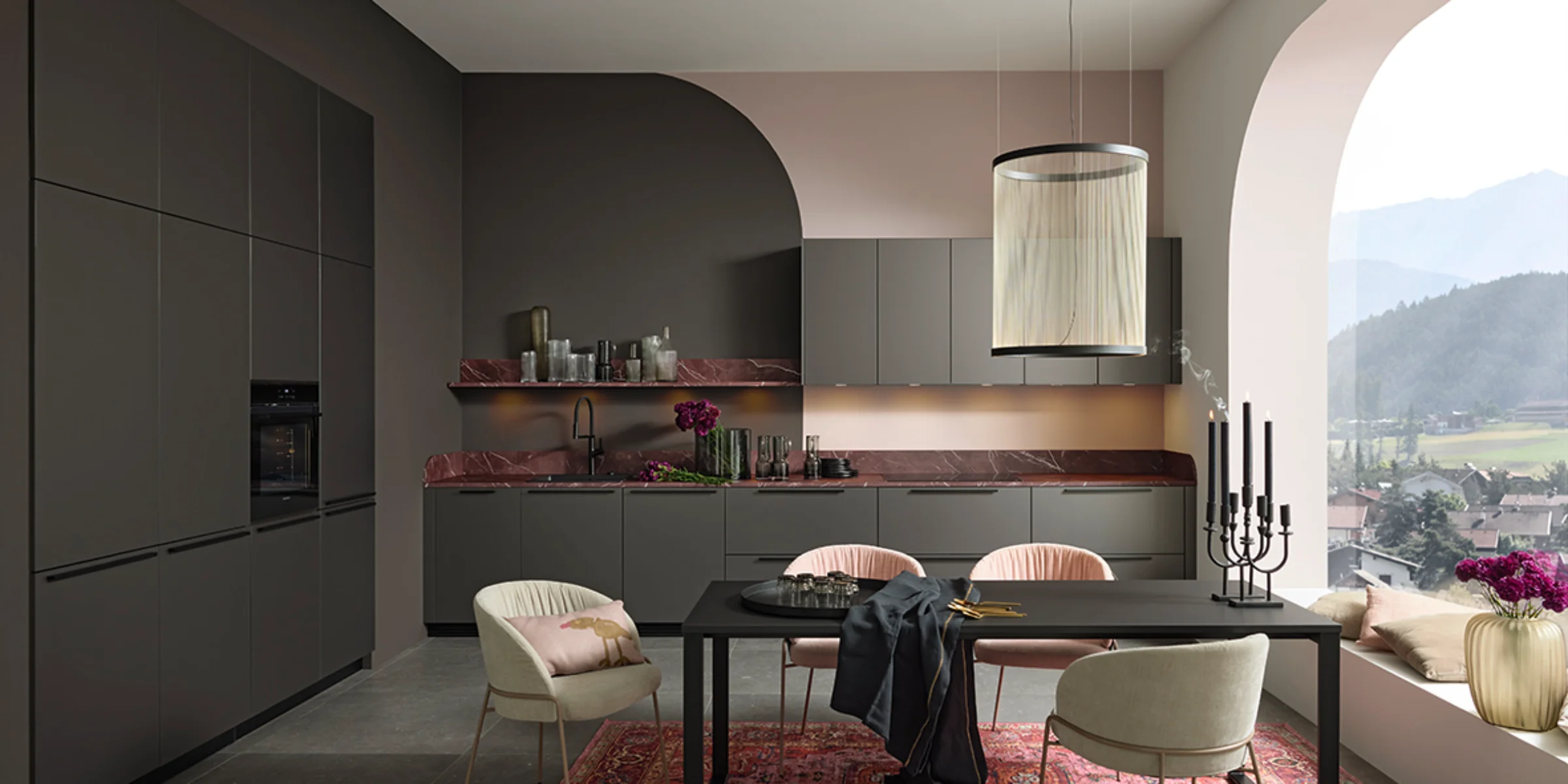 Modern Nolte kitchen with PEARL acrylic glass fronts in Umbra Metallic and a Red Marble countertop