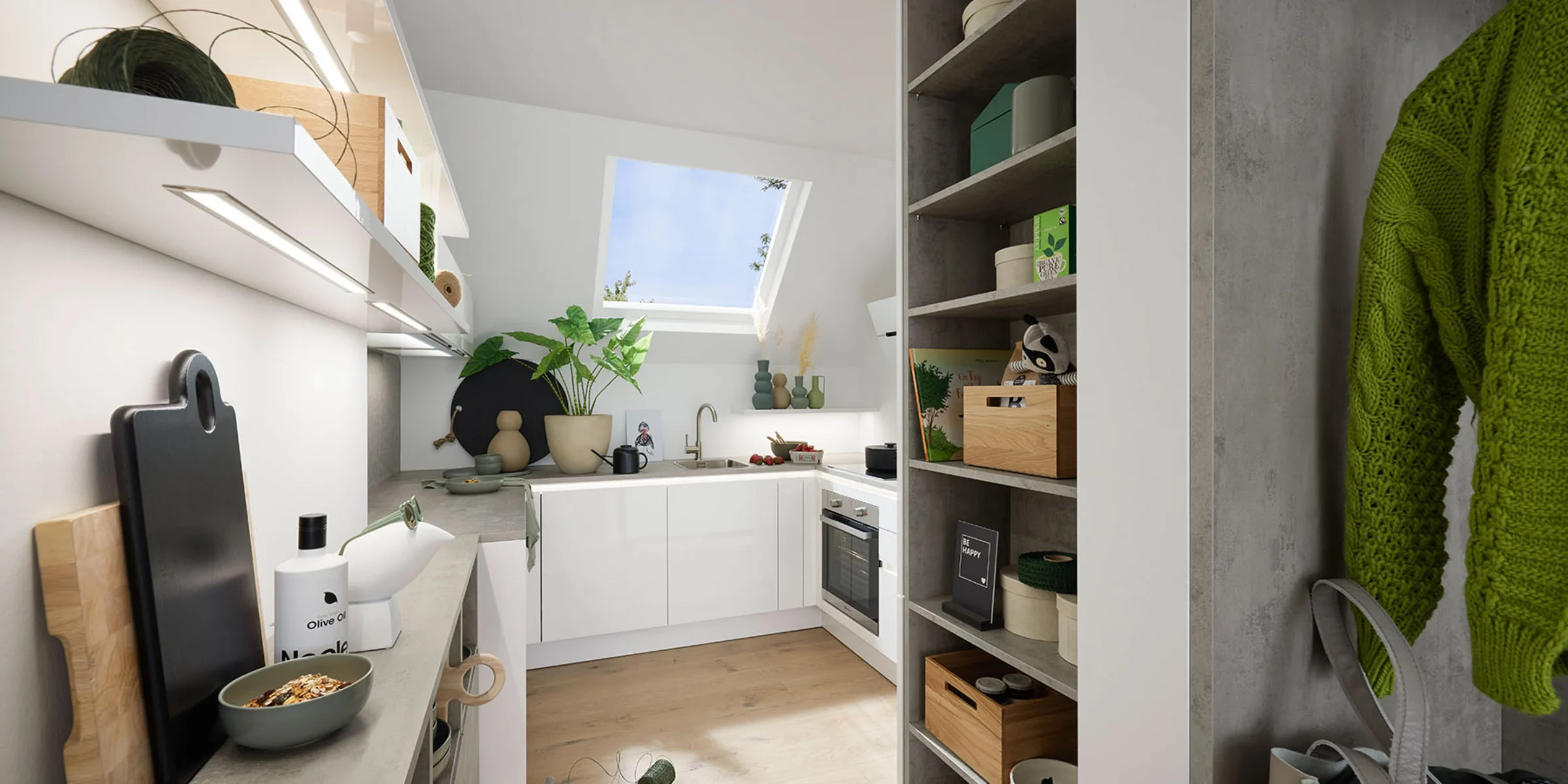 Eine moderne Küche mit weißen Schränken und Pflanzen unter einem Dachfenster von Nolte Küchen.