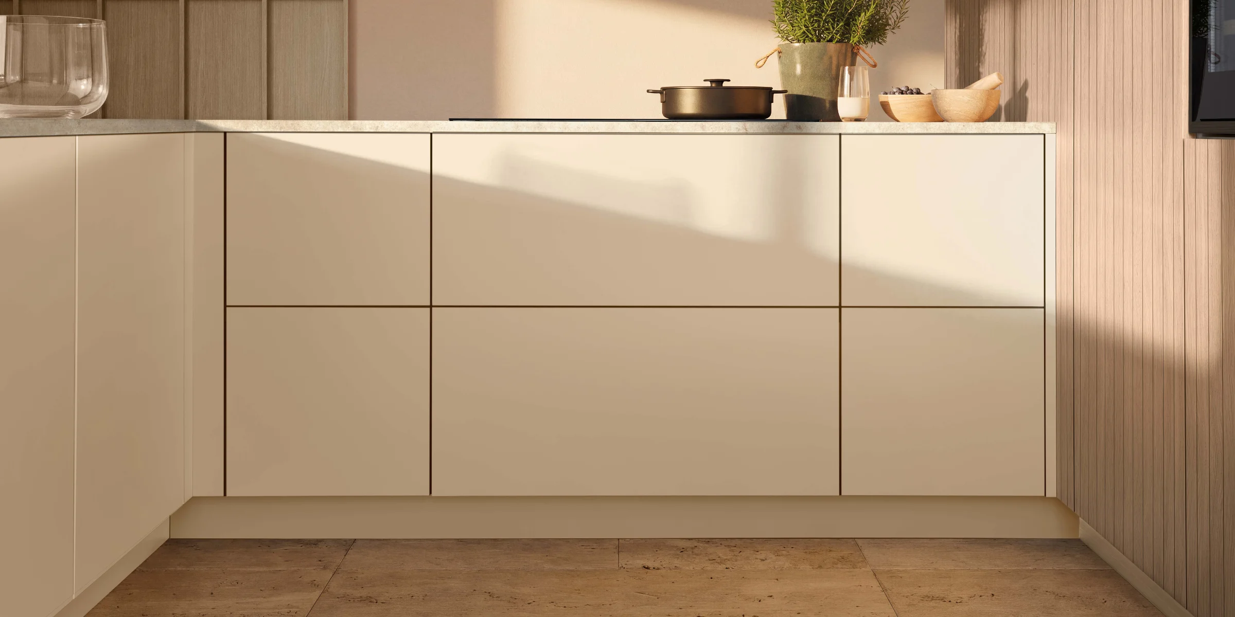 Sunlight shines on elegant cabinets in the modern kitchen. Nolte Kitchens.