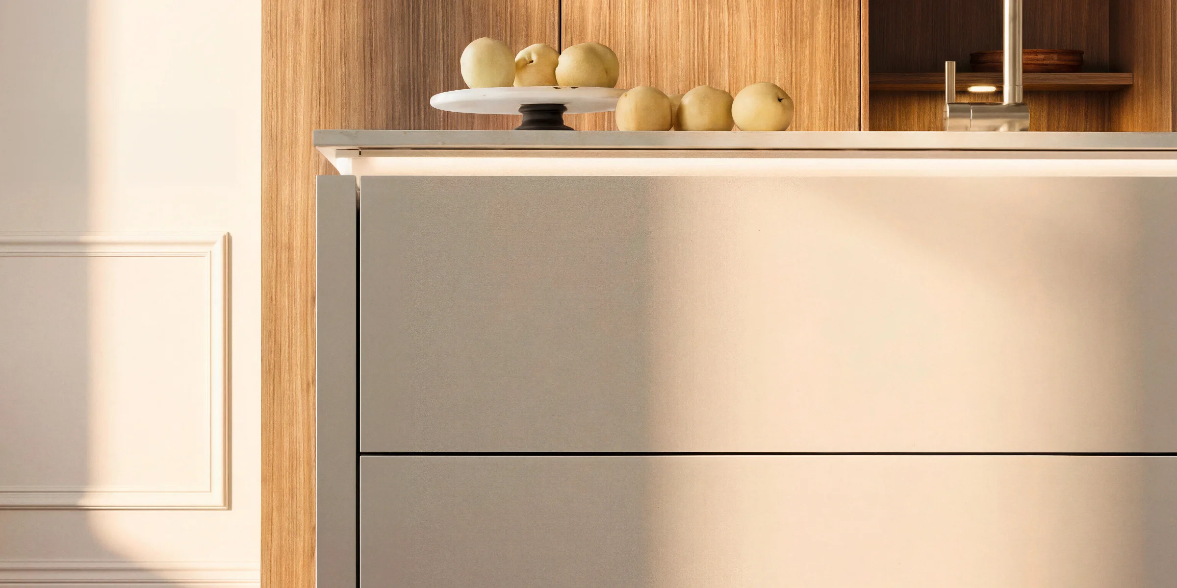 A modern kitchen with wooden cabinets and a white island, Nolte Küchen.