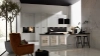 Cucina moderna con armadi bianchi e isola, design elegante di Nolte Kitchen.