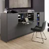 Un espace de vie moderne avec des armoires grises et une table pliante, Nolte Living.