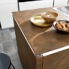 A modern kitchen with a wood-look island and integrated sink by Nolte Kitchen.