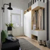 Un hall d'entrée élégant avec penderie, banc et décoration, idéal pour Nolte Living.