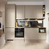 Modern kitchen with beige cabinets and black accents; Nolte Kitchen.