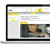 Une cuisine moderne en bois et gris de Nolte Kitchen est affichée sur un ordinateur portable.
