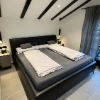 Camera da letto con un grande letto e design moderno, Nolte Living.