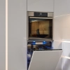 Une cuisine moderne avec lave-vaisselle ouvert, design élégant de Nolte Kitchen.