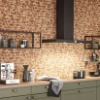 Cucina moderna con parete in mattoni e design Nolte Kitchen.
