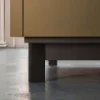 A modern kitchen cabinet stands on a shiny floor. Nolte Küchen.