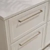 A sleek white kitchen drawer with modern handles, Nolte Kitchens.