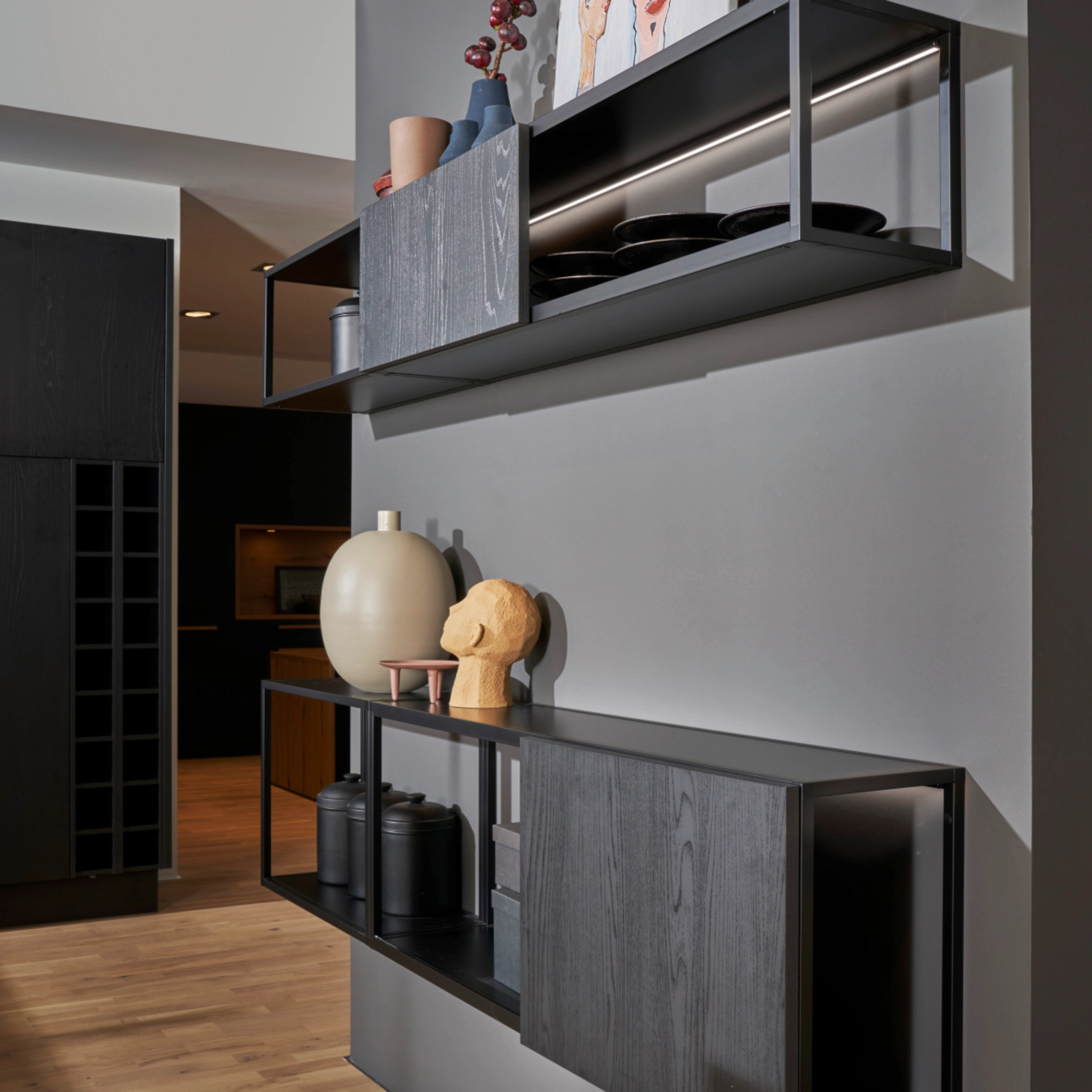 Modern furniture with art and decor on the wall, part of Nolte Living.