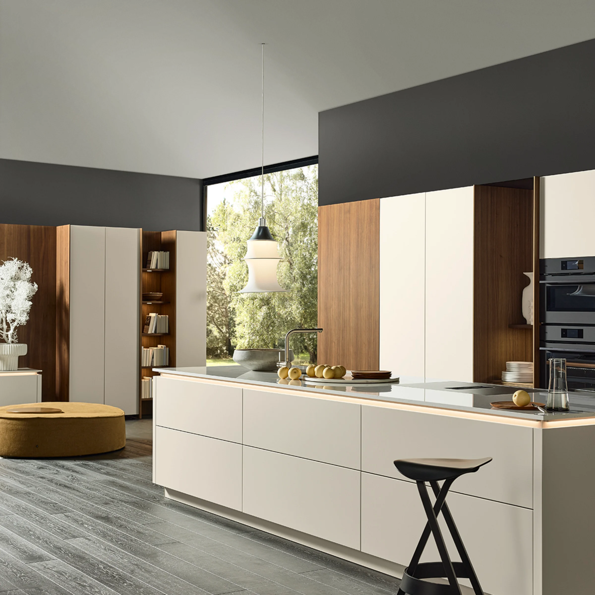 A modern kitchen with an island and wooden accents, Nolte Küchen.