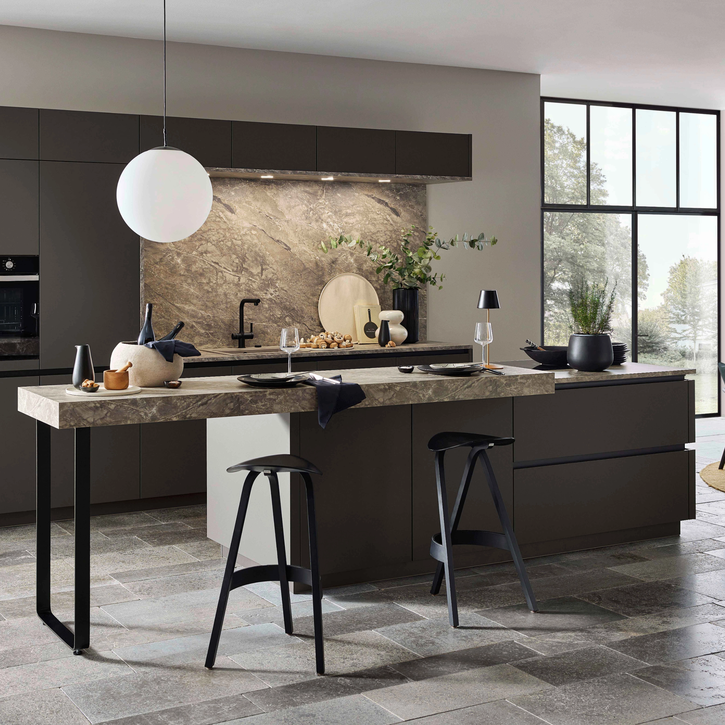 A modern kitchen with an island and stylish details, presented by Nolte Kitchen.
