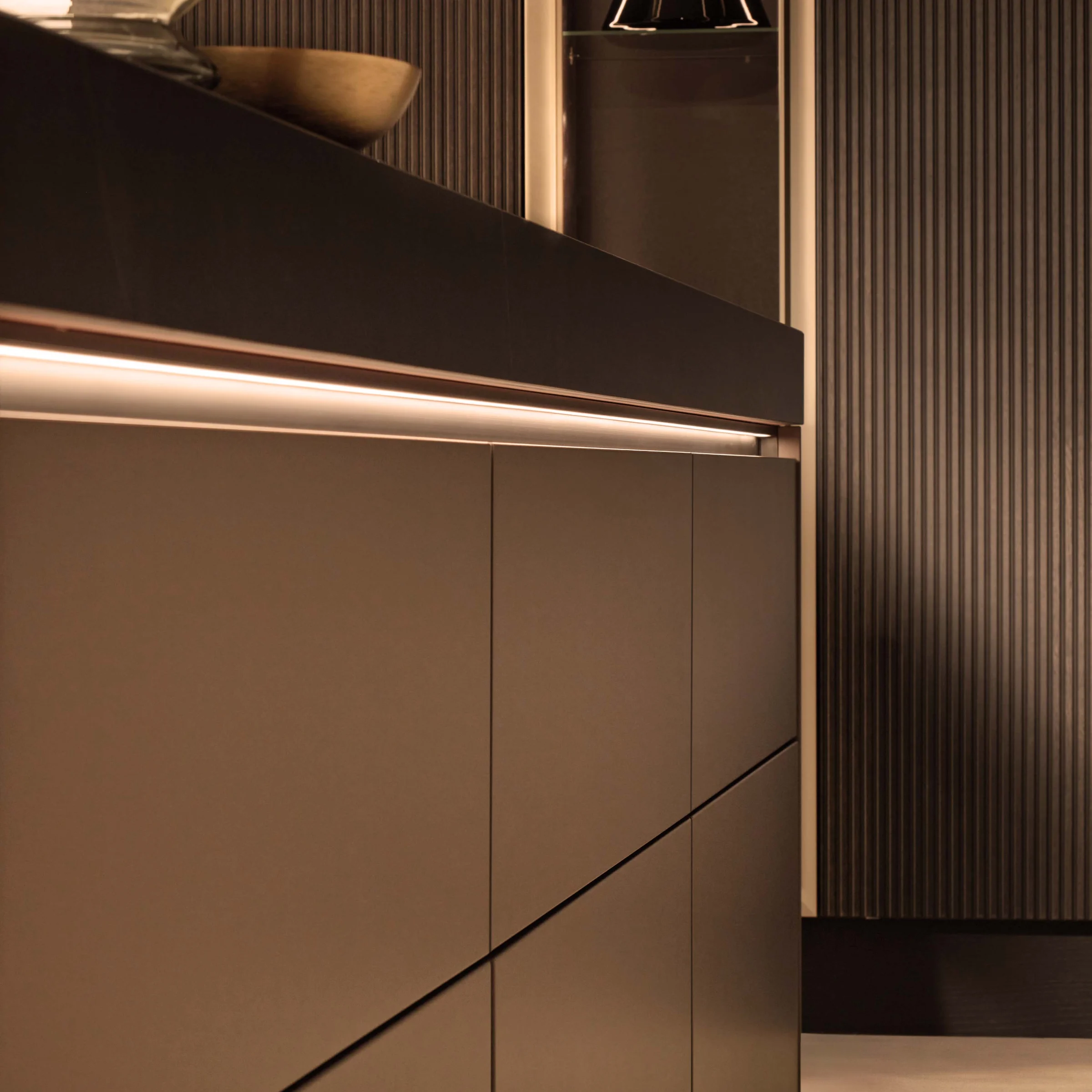 A modern, elegant kitchenette with subtle lighting, Nolte Küchen.