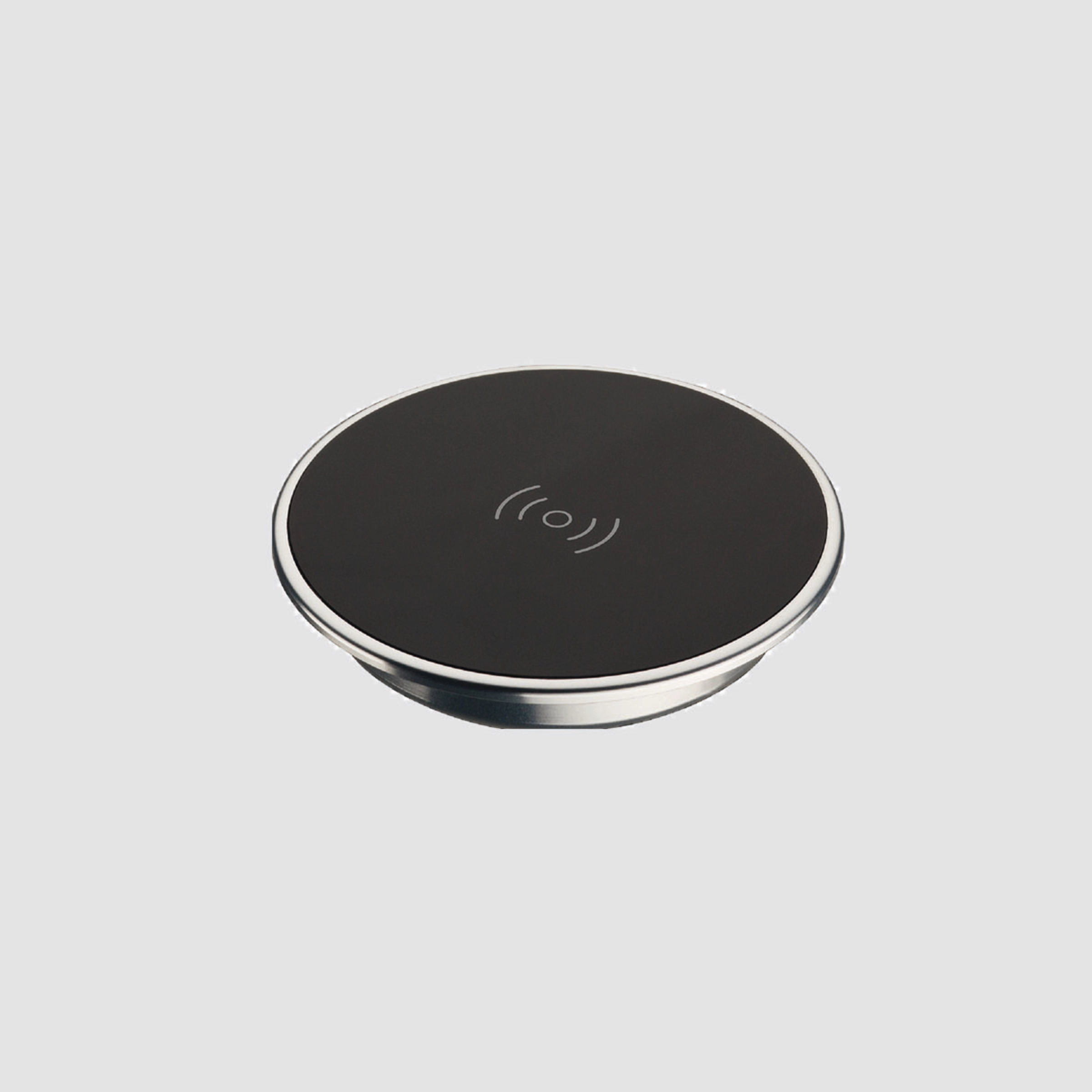 Chargeur rond noir sur fond gris.