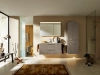 Ein modernes Badezimmer mit Holzschrank und Glasdusche, elegant gestaltet von Nolte SPA.