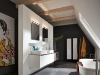 Salle de bain moderne avec baignoire autoportante et double vasque, conçue par Nolte SPA.