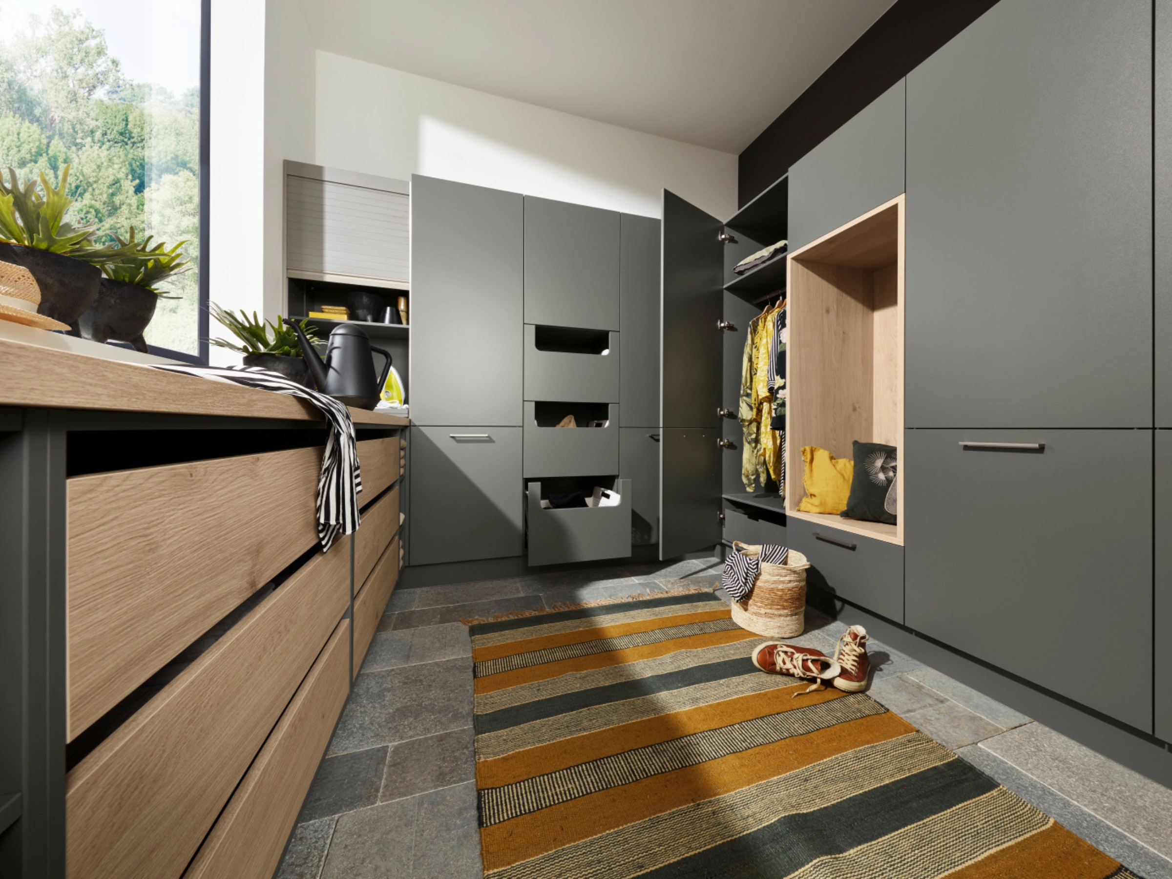 A utility room with gray cabinets and storage solutions, Nolte utility rooms.