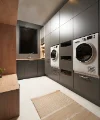 Buanderie moderne avec lave-linge et sèche-linge au design élégant de Nolte.