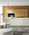 A modern kitchen with white cabinets and an island by Nolte Küchen.