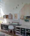 A stylishly designed kids' room with toy shelves and a desk, perfect for Nolte Living.