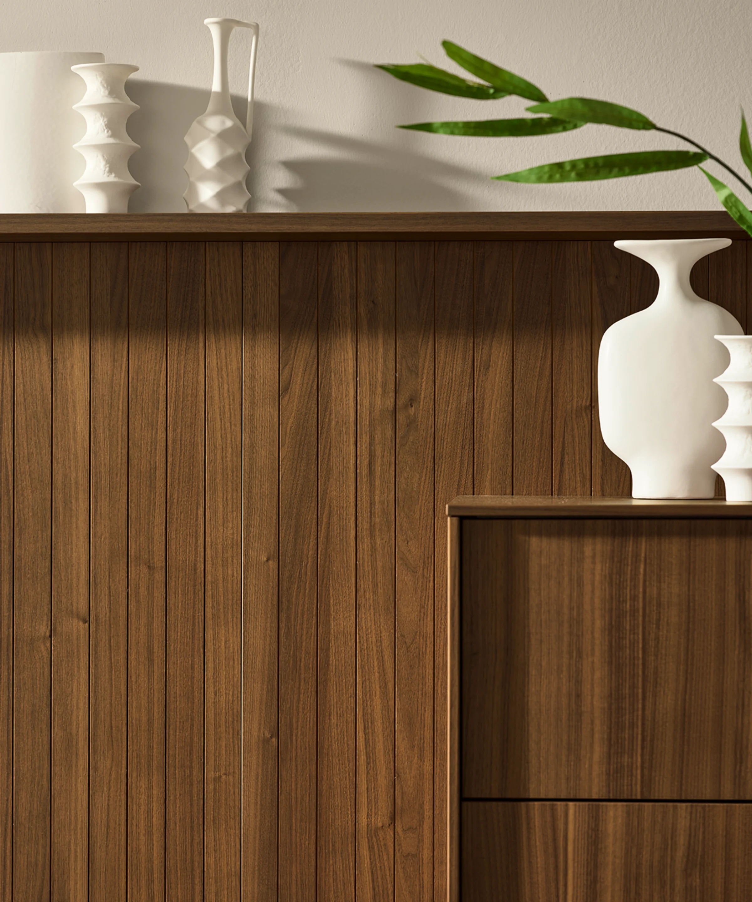 Elegant living furniture with decorative vases, Nolte Living.